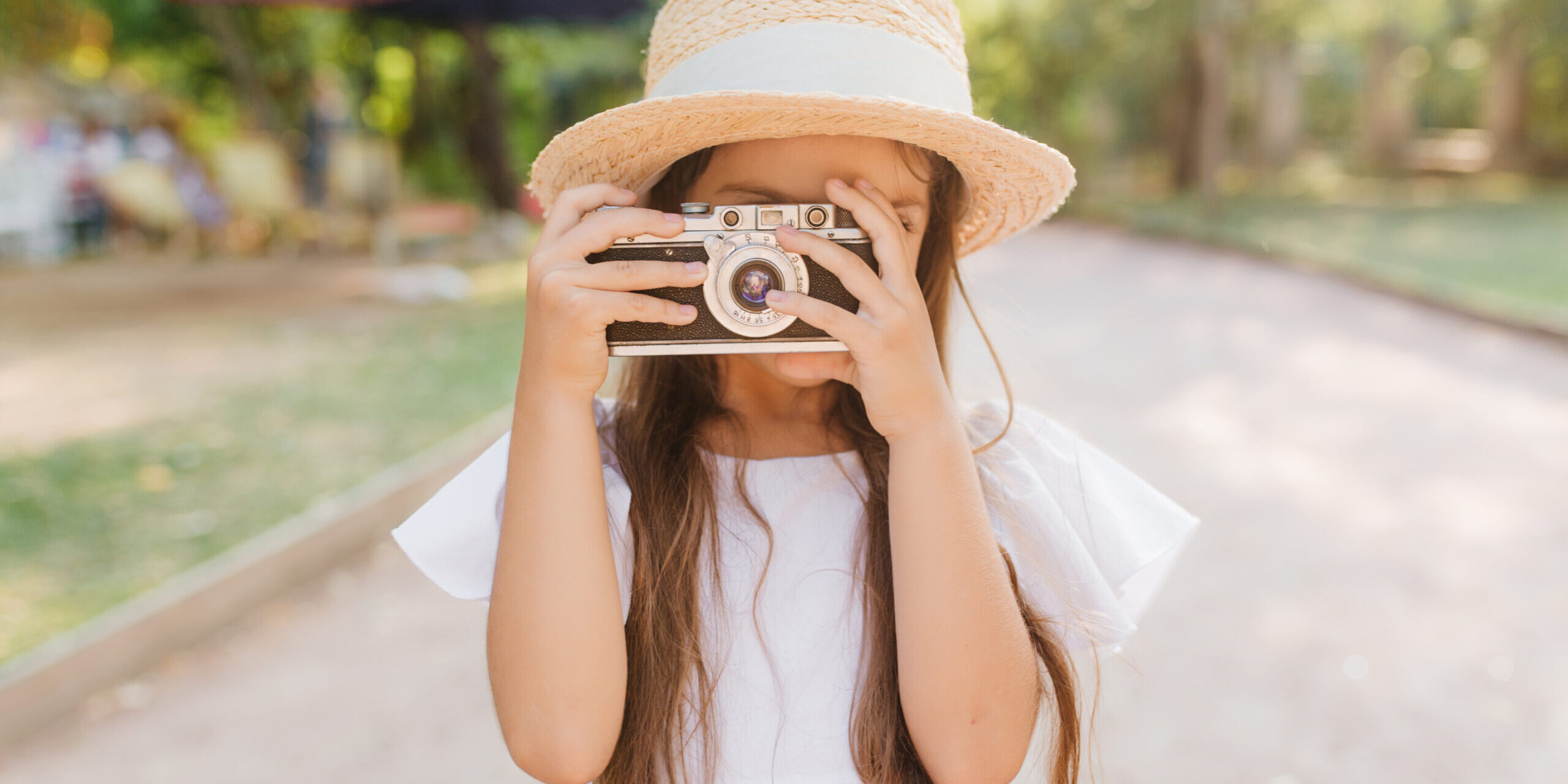 Child with Camera taking a photo of Nature Scenes