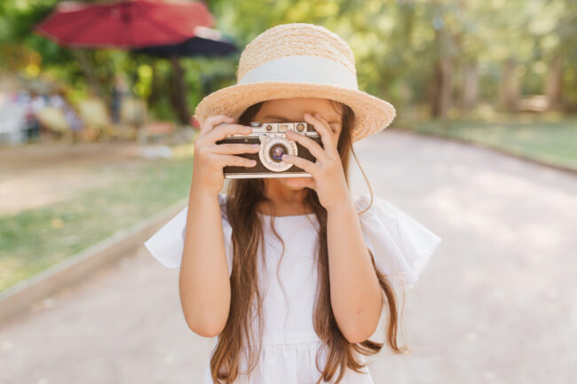 Child with Camera taking a photo of Nature Scenes